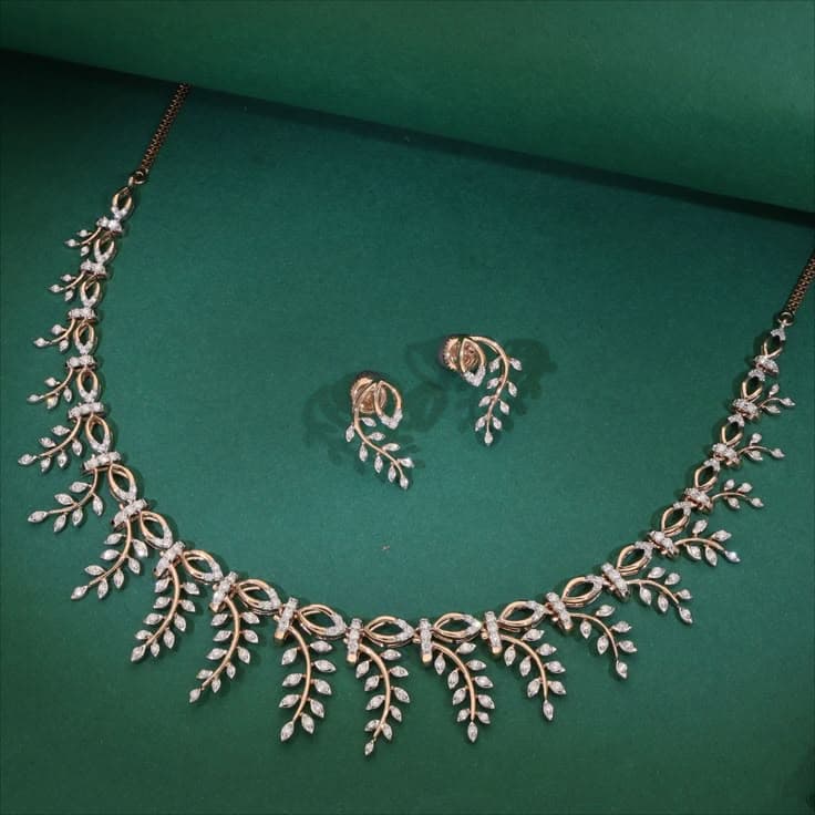 Gold necklace and earrings from Babu Jewellers